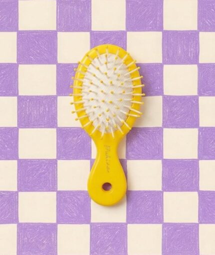 Yellow mini hairbrush